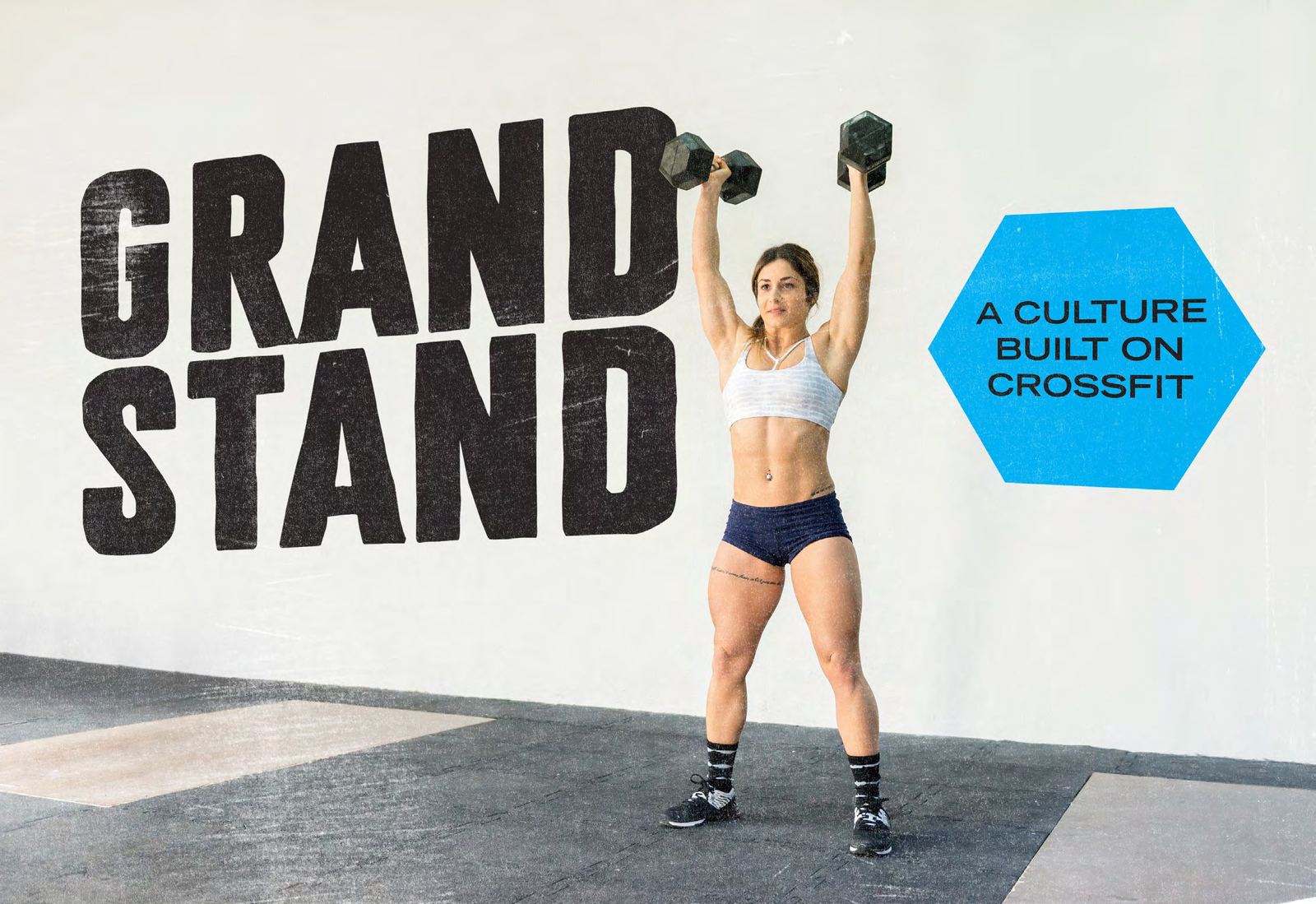 Personal training session with dumbbell press at Grandstand CrossFit