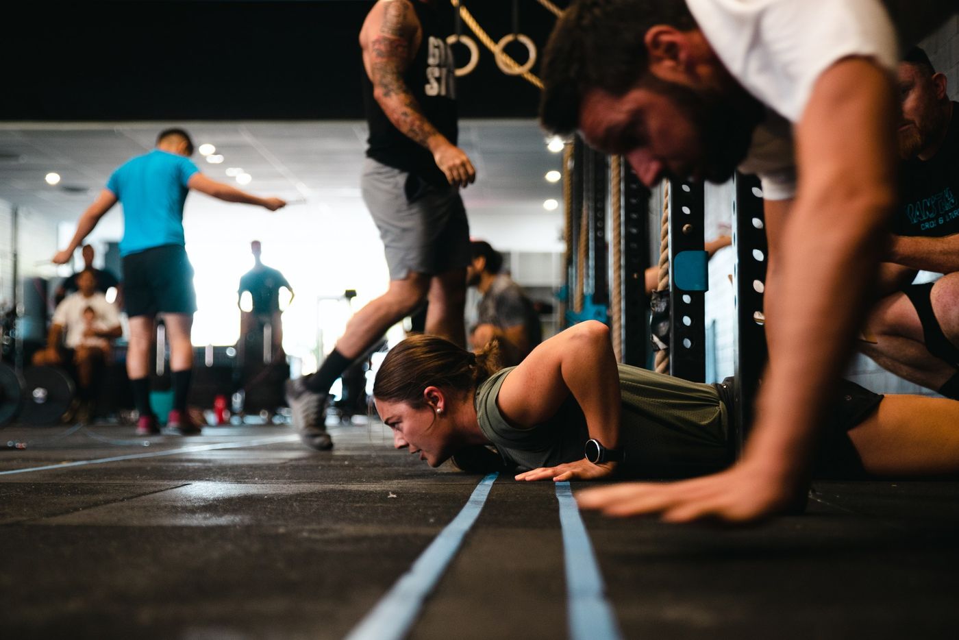 Grandstand coach working one-on-one with an athlete on the gym floor